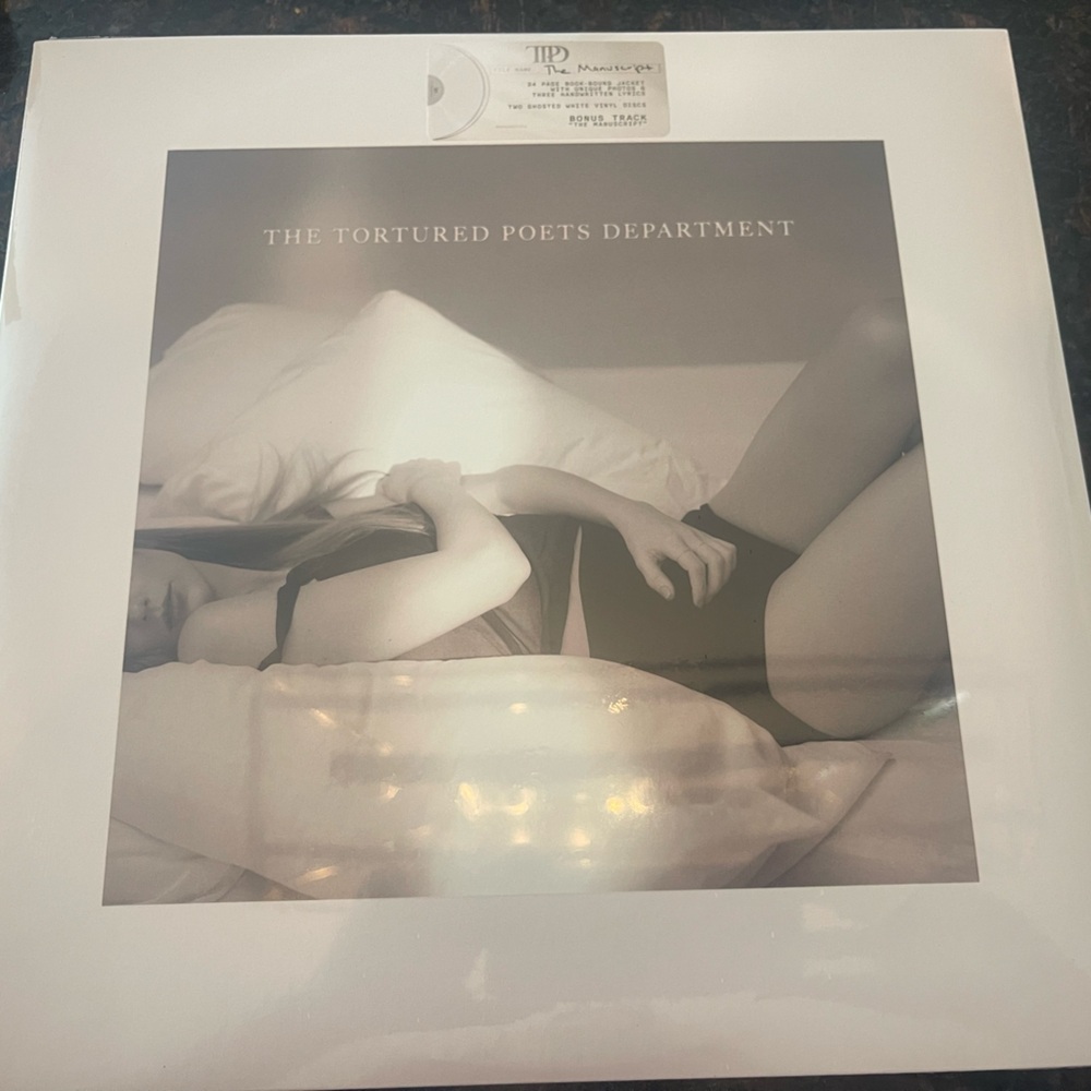 Unopened The tortured poets department vinyl with signed photograph.